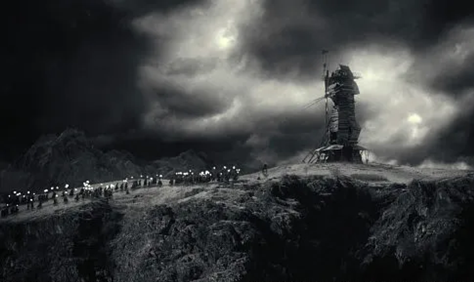 Frightened and enraged villagers chase Frankenstein's monster to the top of a windmill.