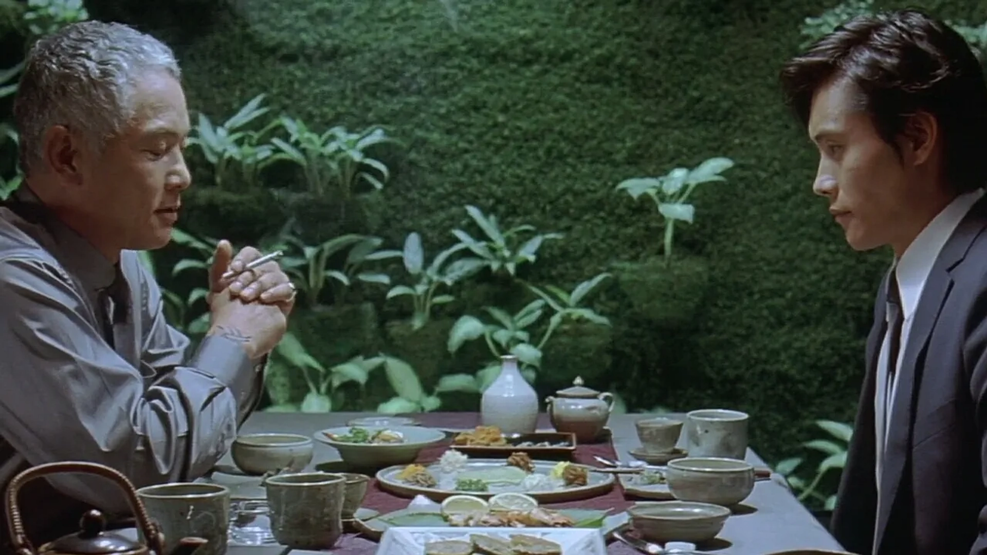 Lee Byung-hun and Kim Yeong-cheol in A Bittersweet Life (2005)