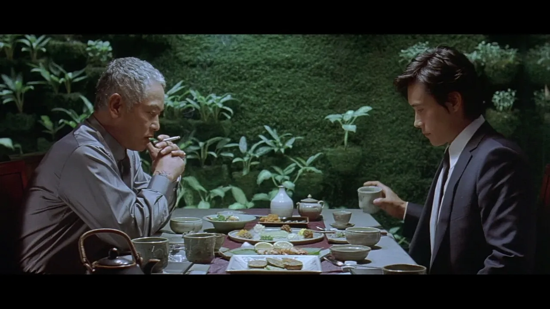Lee Byung-hun and Kim Yeong-cheol in A Bittersweet Life (2005)