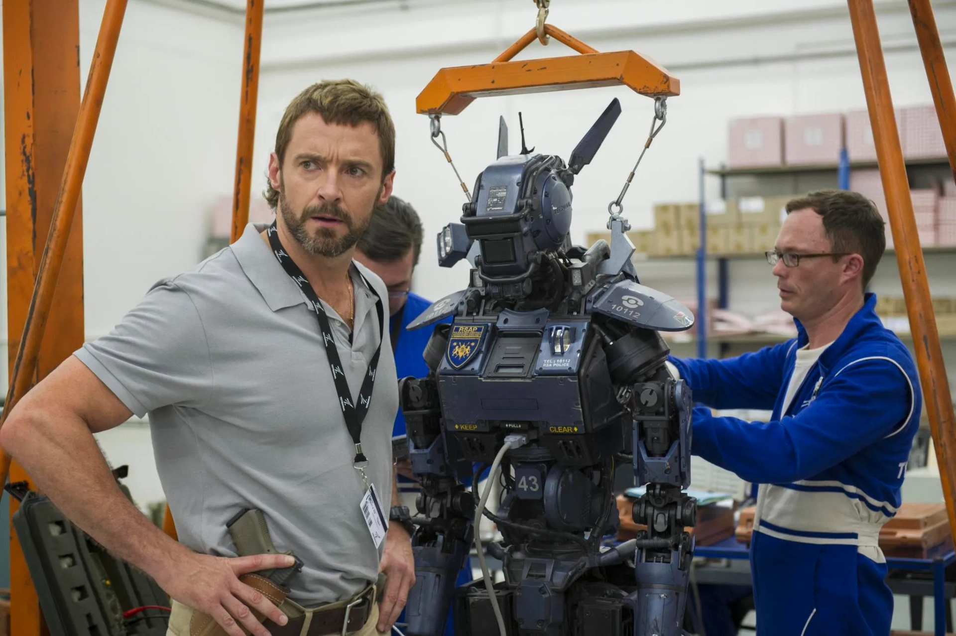 Hugh Jackman and Jason Cope in Chappie (2015)