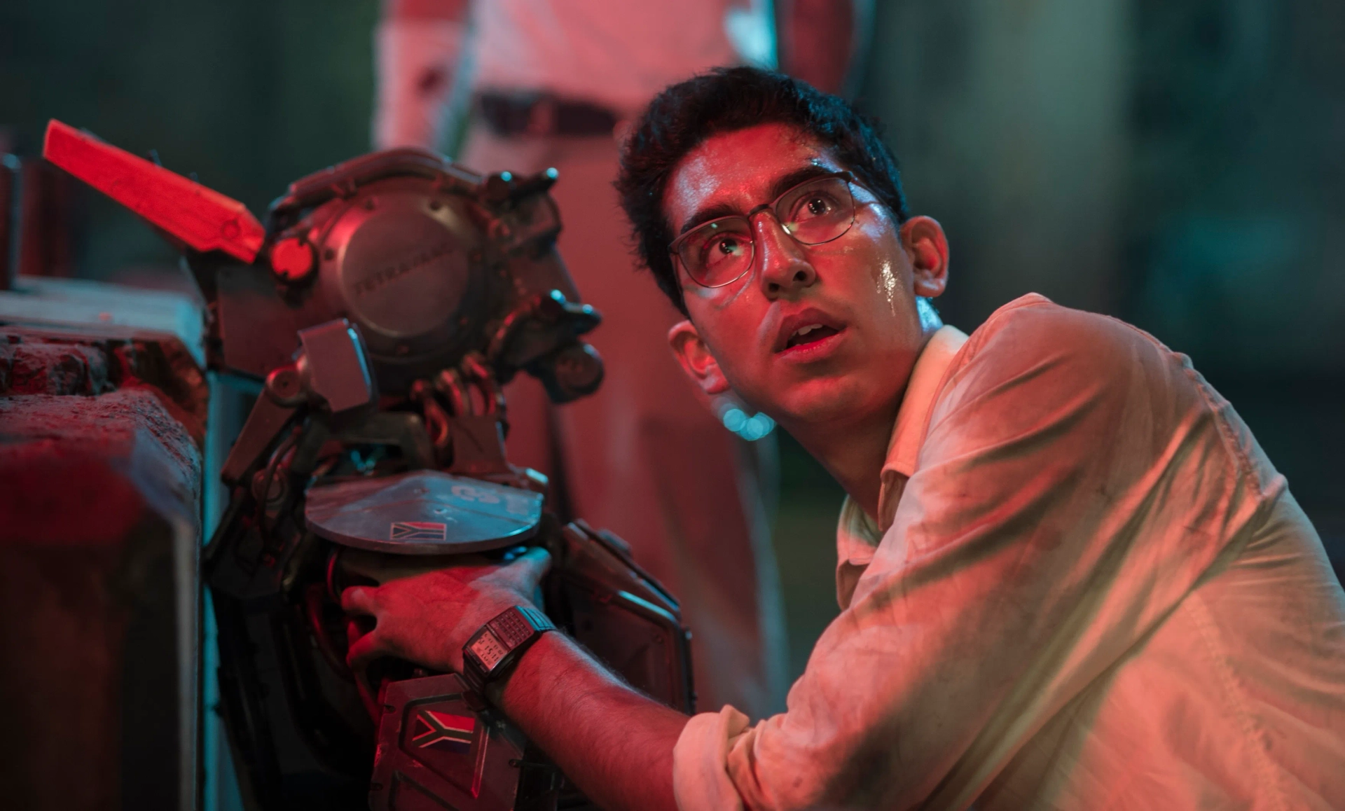 Sharlto Copley and Dev Patel in Chappie (2015)