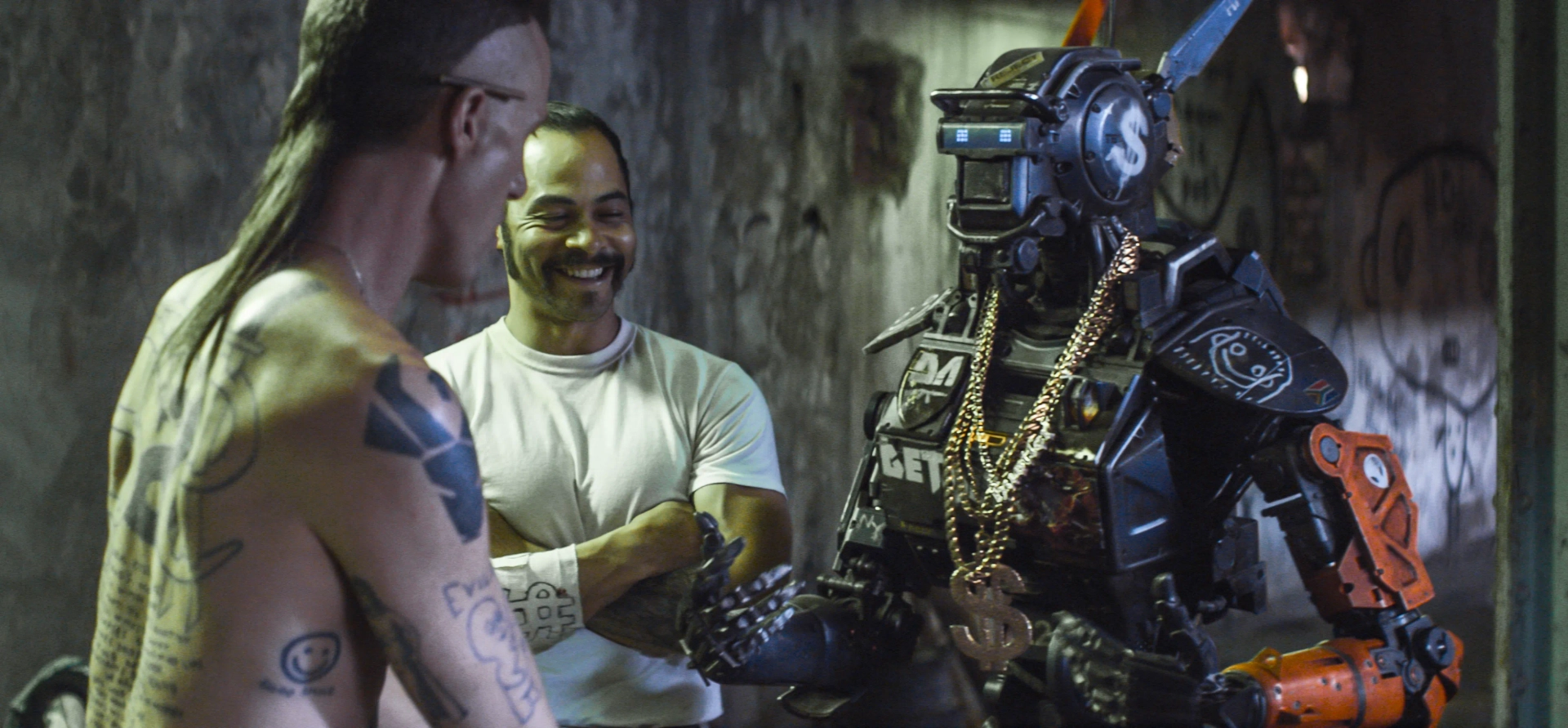 Jose Pablo Cantillo, Sharlto Copley, and Ninja in Chappie (2015)