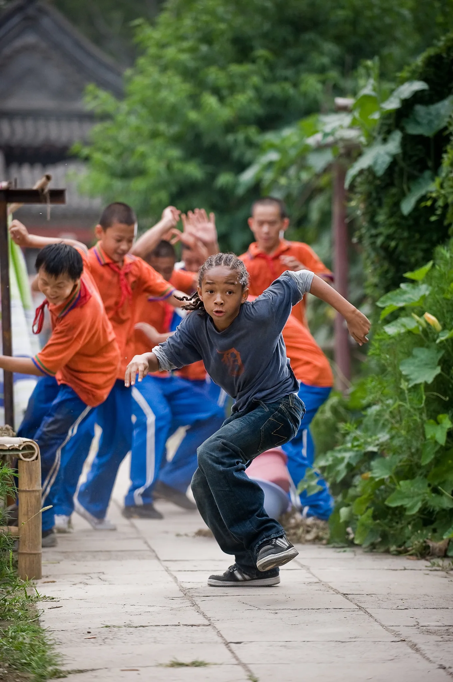 Jaden Smith and Zhenwei Wang in The Karate Kid (2010)
