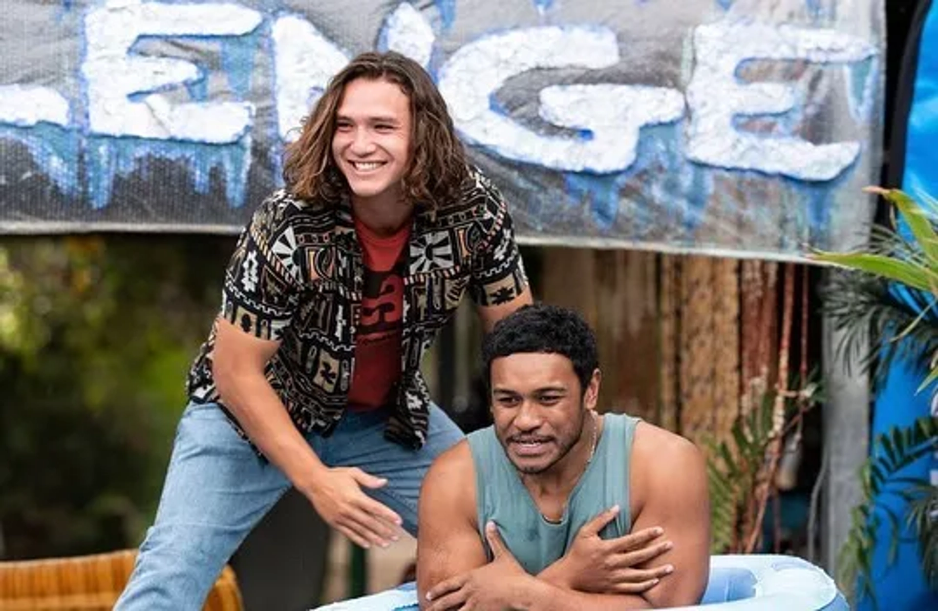 Chris Alosio and Cantona Stewart in Surviving Summer (2022)
