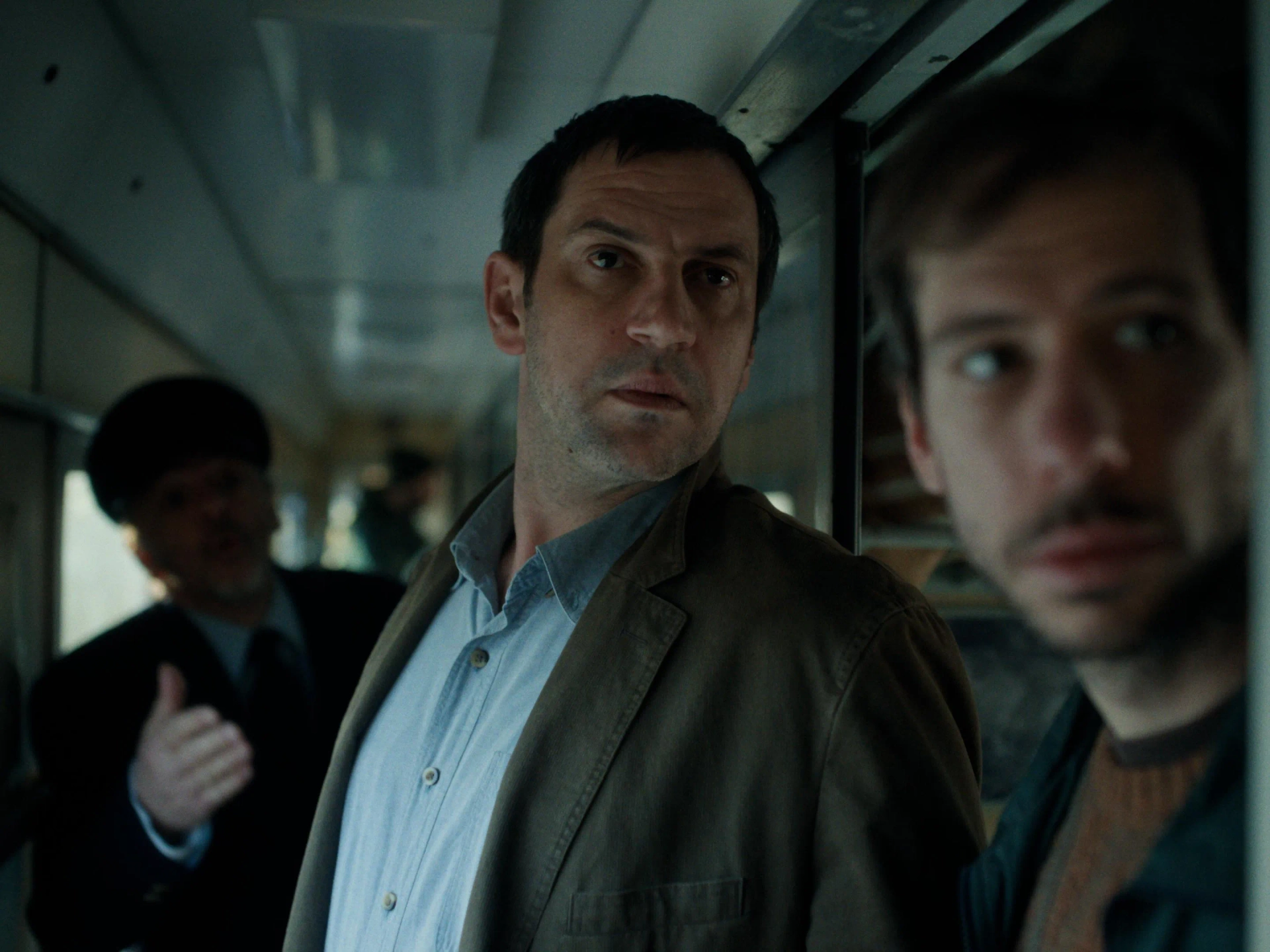 Goran Bogdan, Nebojsa Pop Tasic, and Silvio Mumelas in The Man Who Could Not Remain Silent (2024)