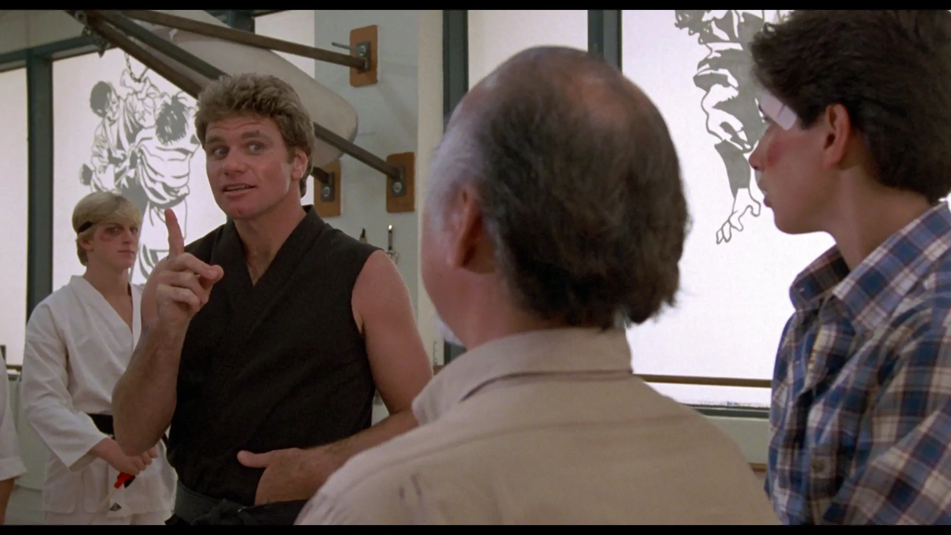 Ralph Macchio, Pat Morita, Martin Kove, and William Zabka in The Karate Kid (1984)