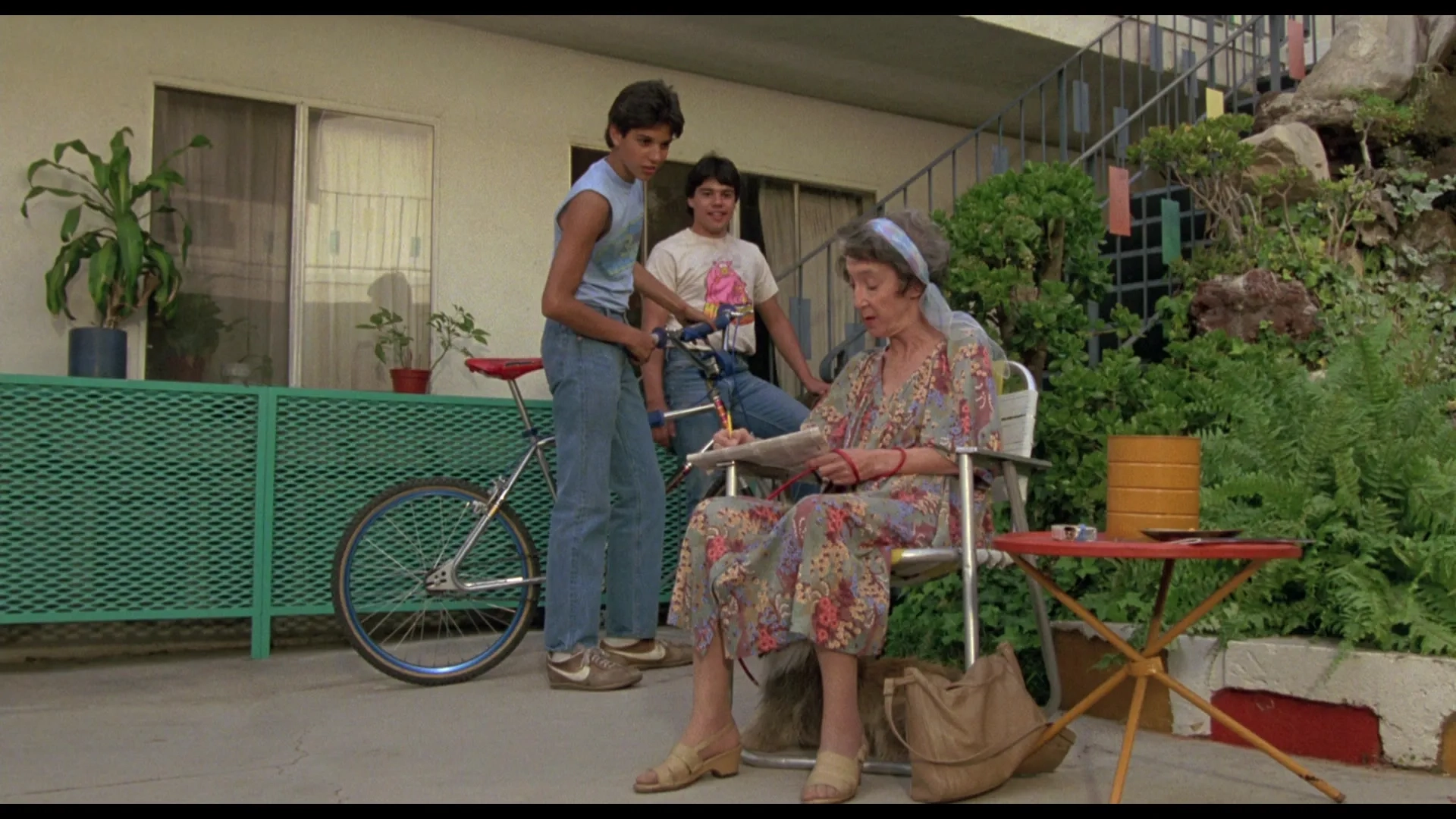 Ralph Macchio, Frances Bay, and Israel Juarbe in The Karate Kid (1984)