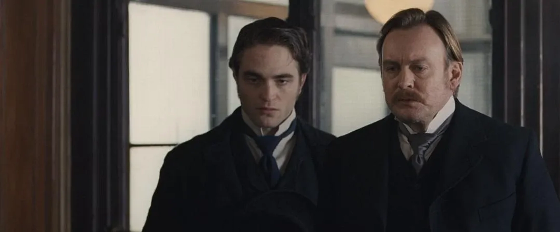 Philip Glenister and Robert Pattinson in Bel Ami (2012)