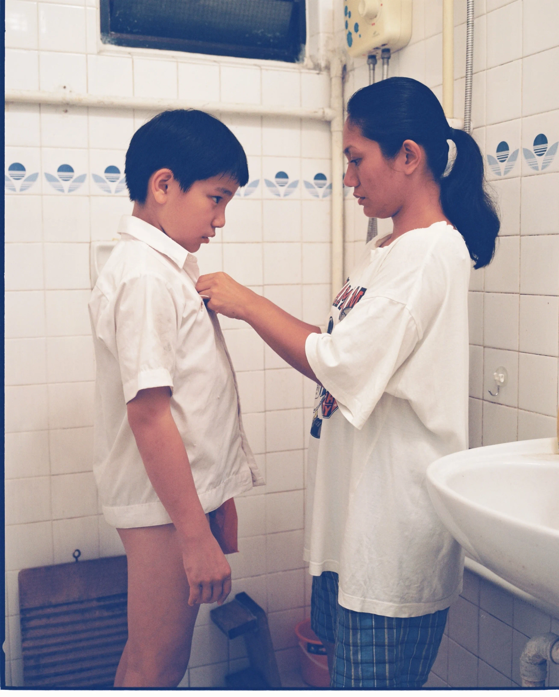 Angeli Bayani and Jia Ler Koh in Ilo Ilo (2013)