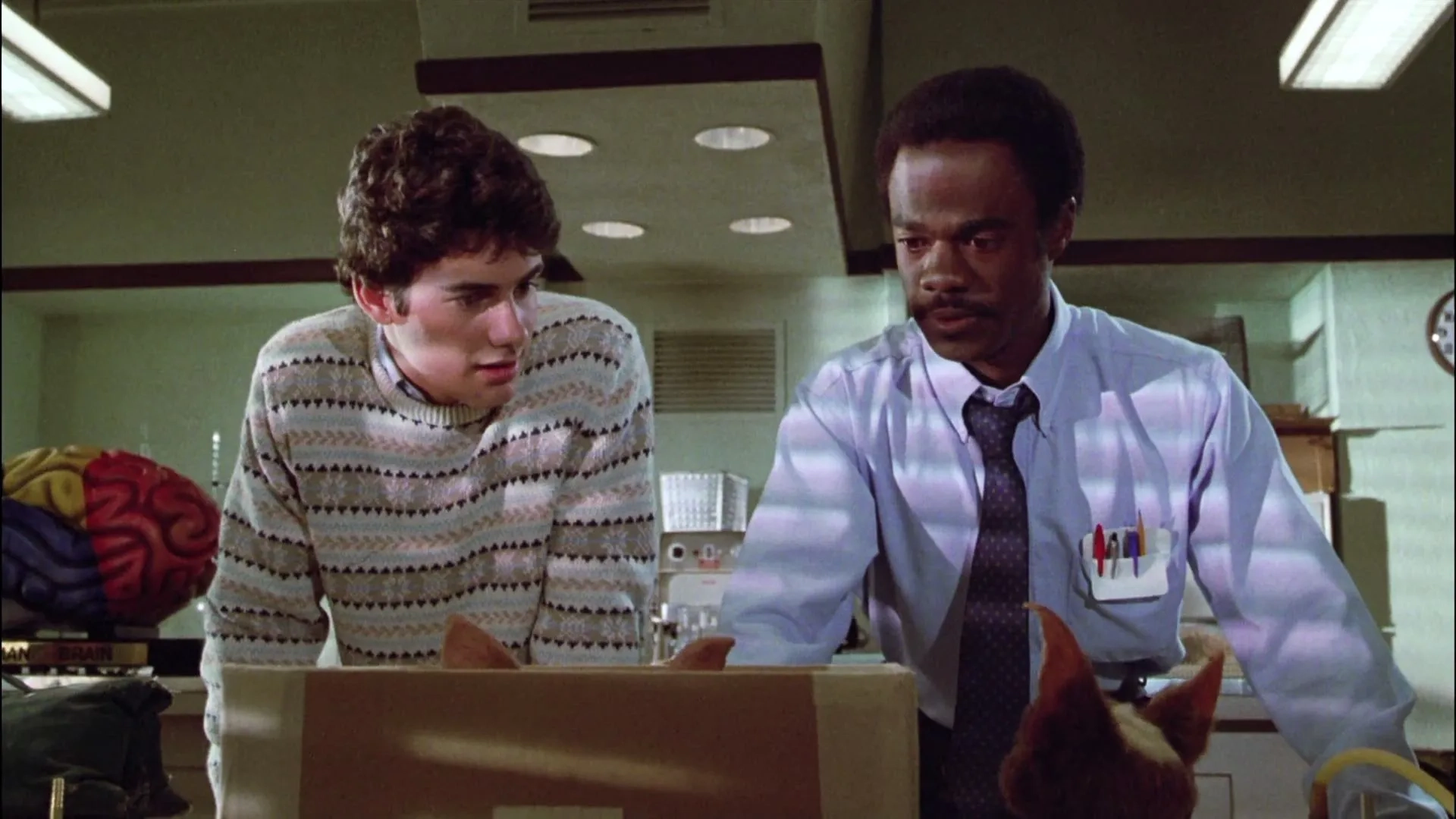 Zach Galligan and Glynn Turman in Gremlins (1984)