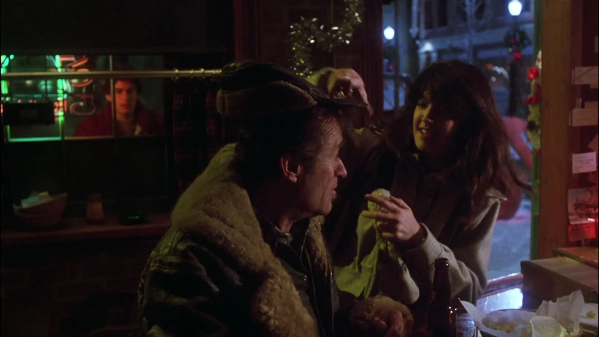 Phoebe Cates, Zach Galligan, and Dick Miller in Gremlins (1984)