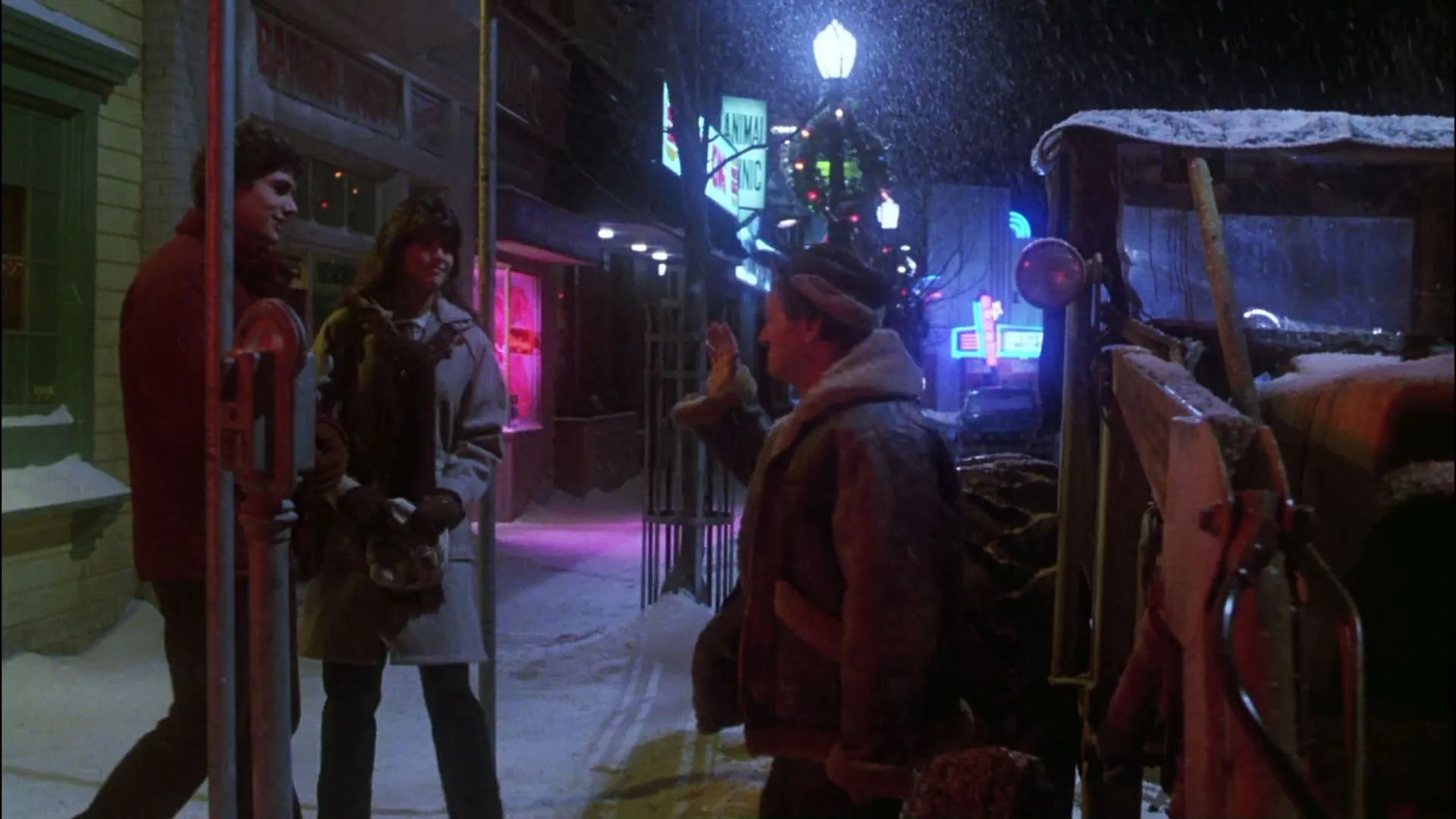 Phoebe Cates, Zach Galligan, and Dick Miller in Gremlins (1984)