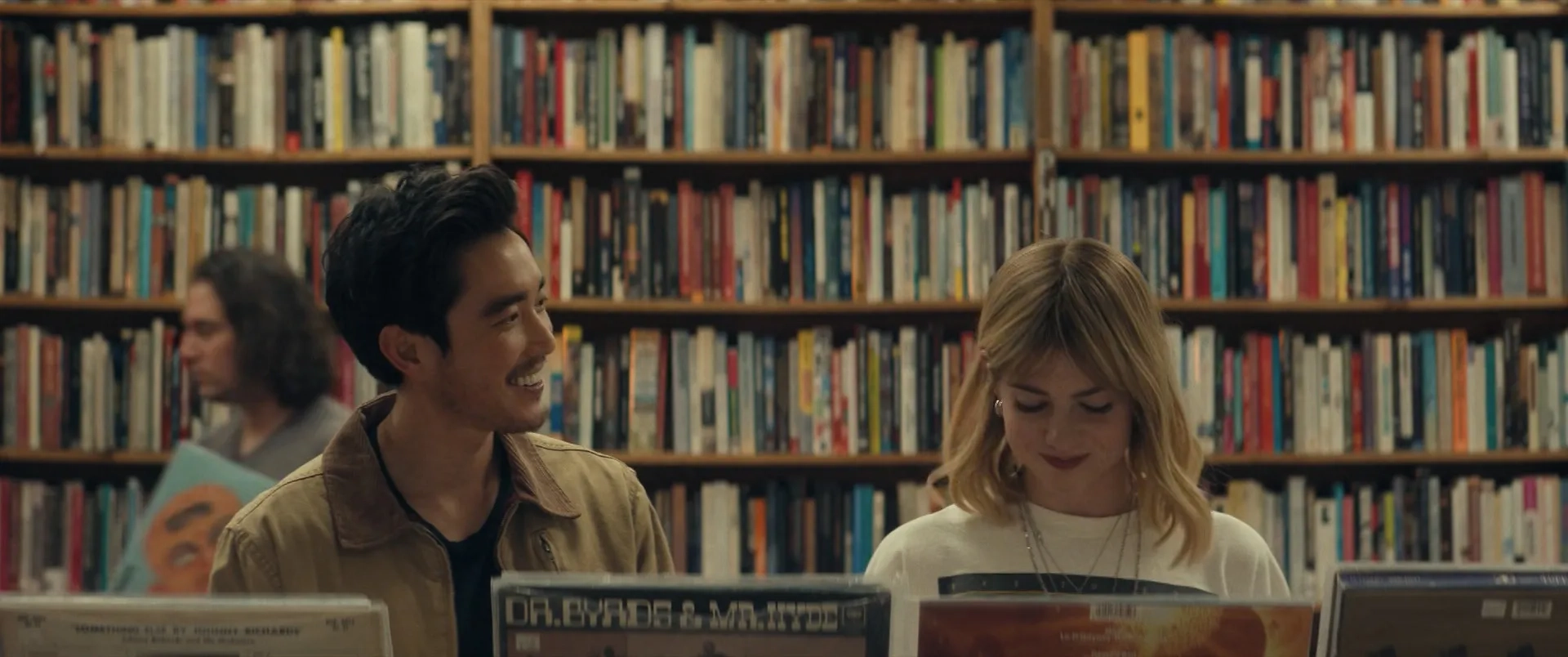 Lucy Boynton and Justin H. Min in The Greatest Hits (2024)