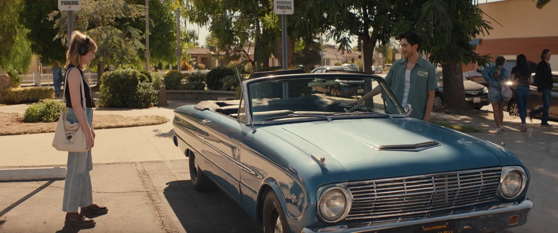 Lucy Boynton and Justin H. Min in The Greatest Hits (2024)