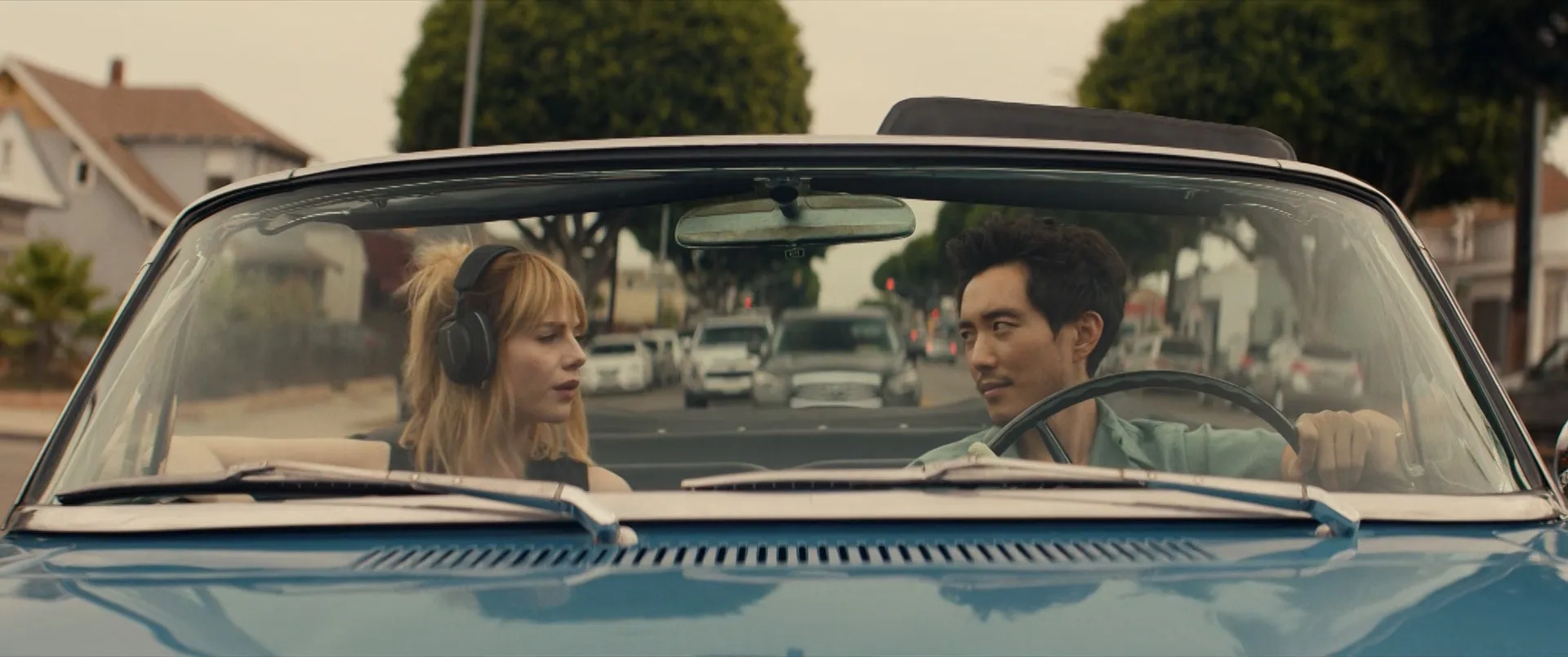 Lucy Boynton and Justin H. Min in The Greatest Hits (2024)