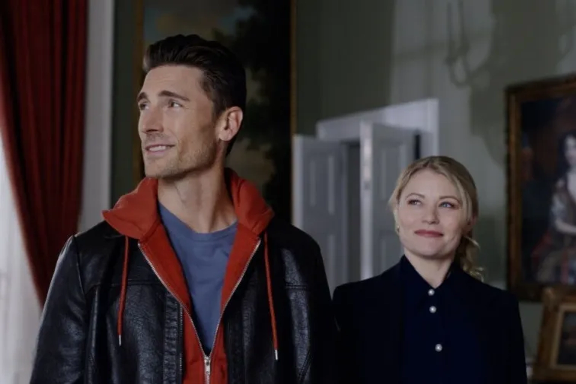 Emilie de Ravin and Andrew W. Walker in The Reluctant Royal (2025)