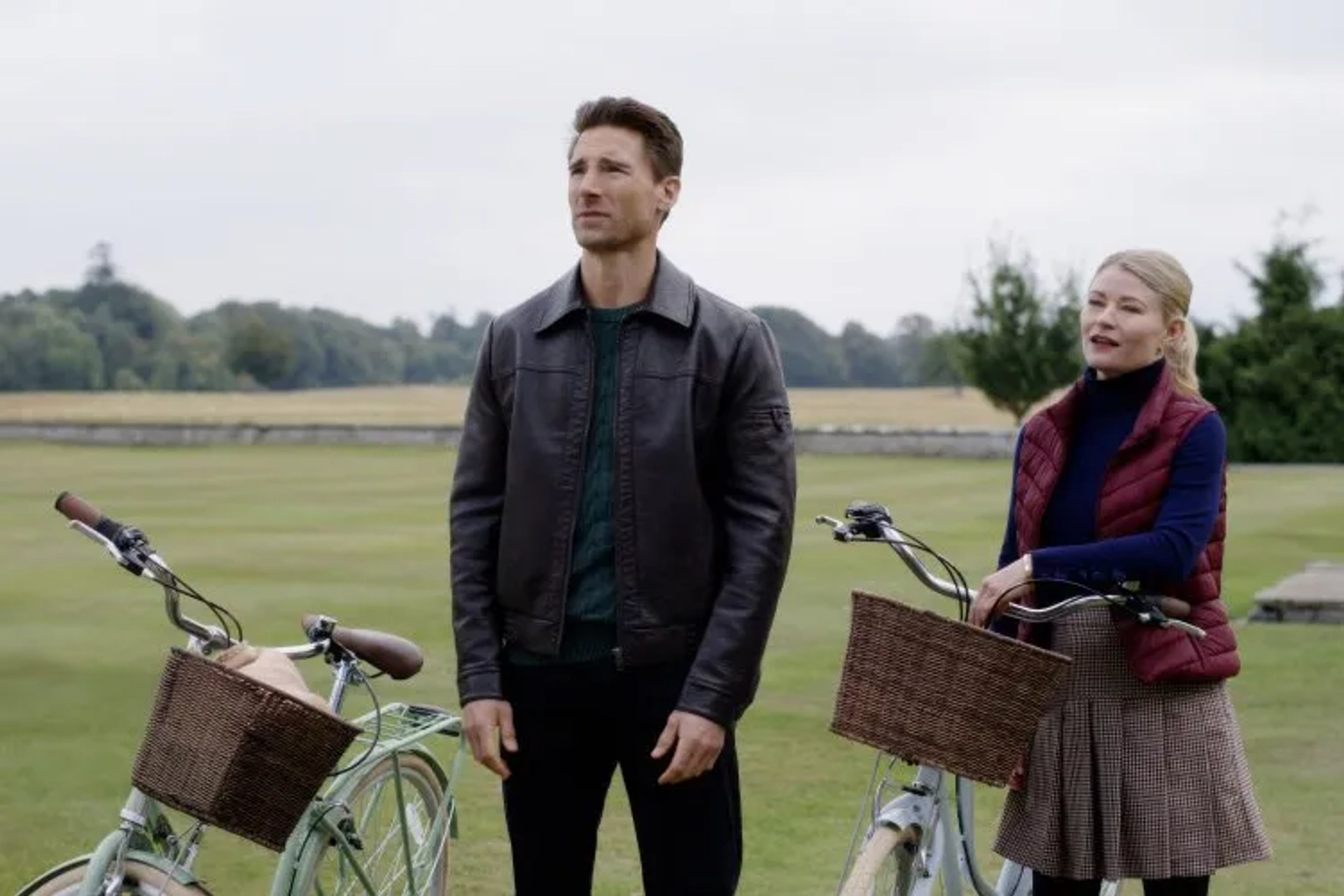 Emilie de Ravin and Andrew W. Walker in The Reluctant Royal (2025)