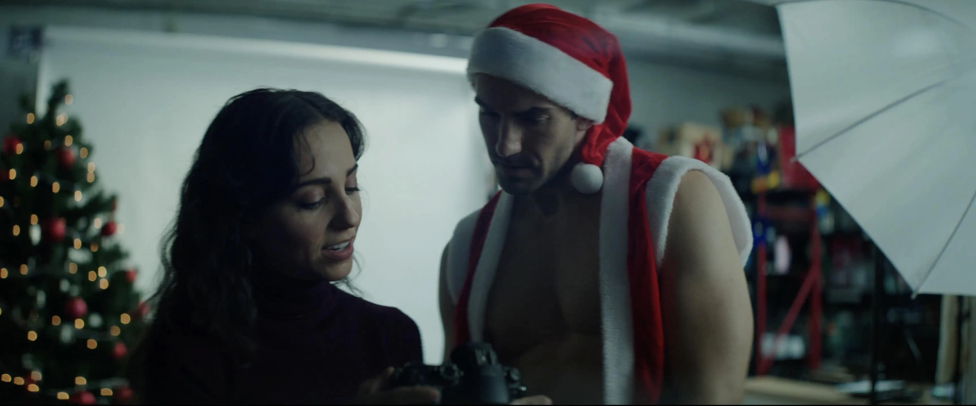 Skye Coyne and Colin Koth in The Naughty List of Mr. Scrooge (2024)