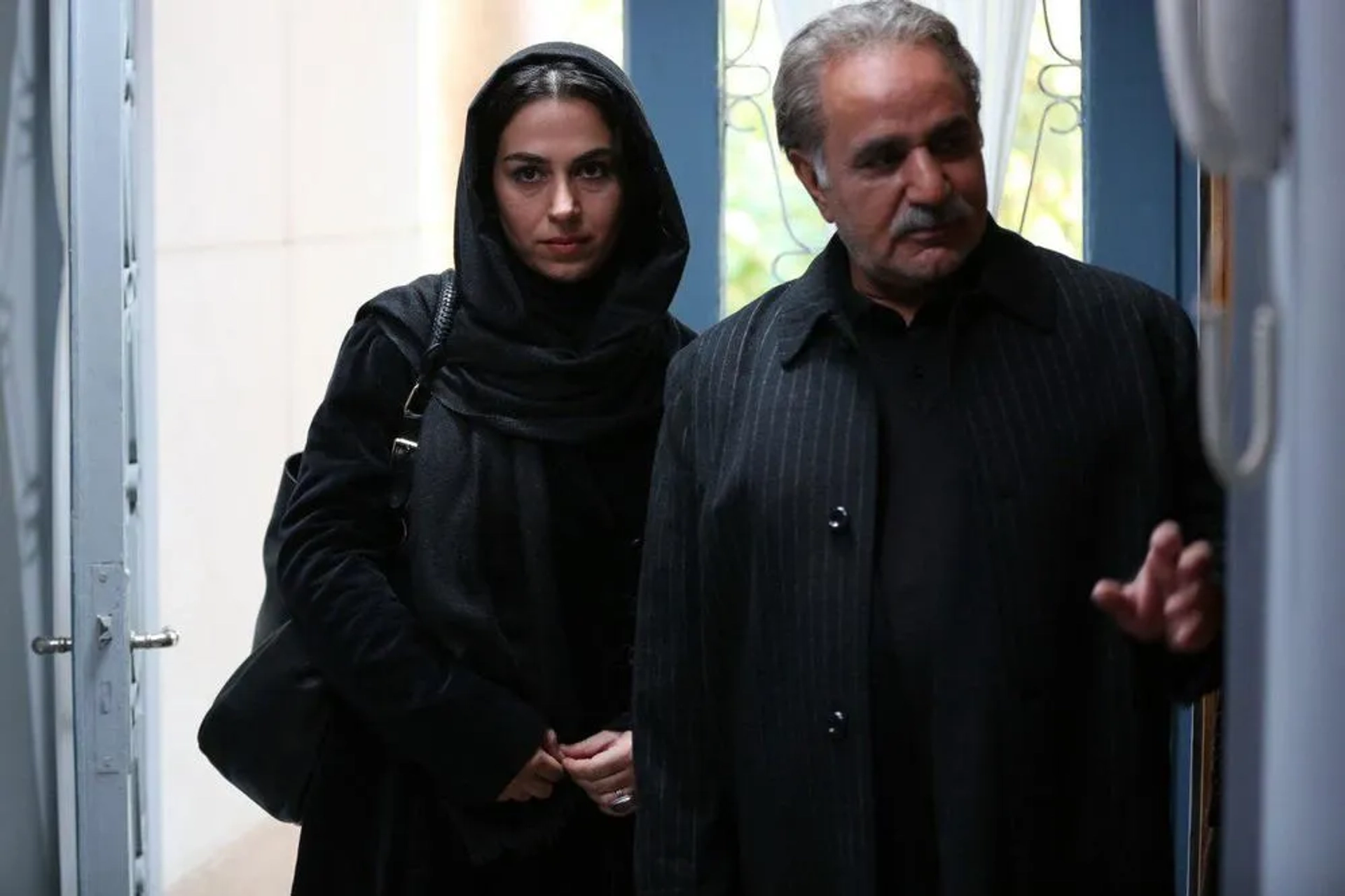 Parviz Parastui and Tina Pakravan in House of Paper (2017)