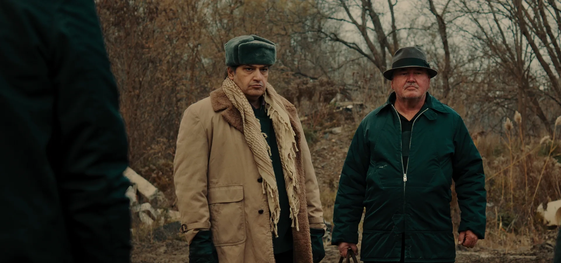 Sam Slessor and Babak Baharestan in Armed (2025)