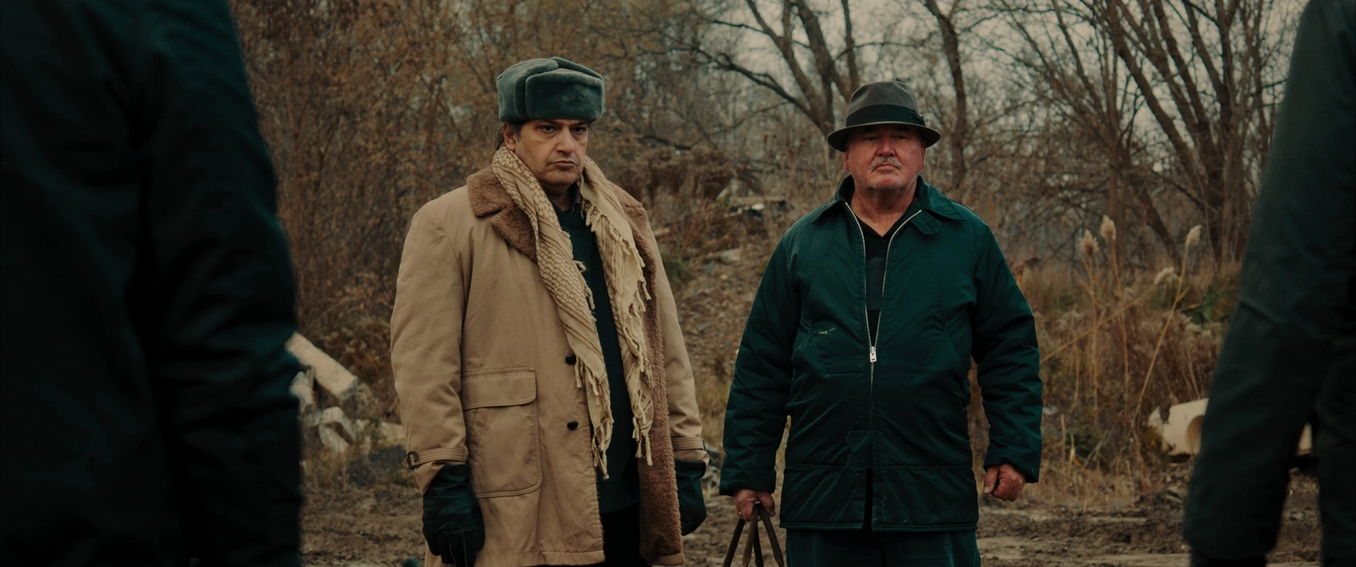 Sam Slessor and Babak Baharestan in Armed (2025)