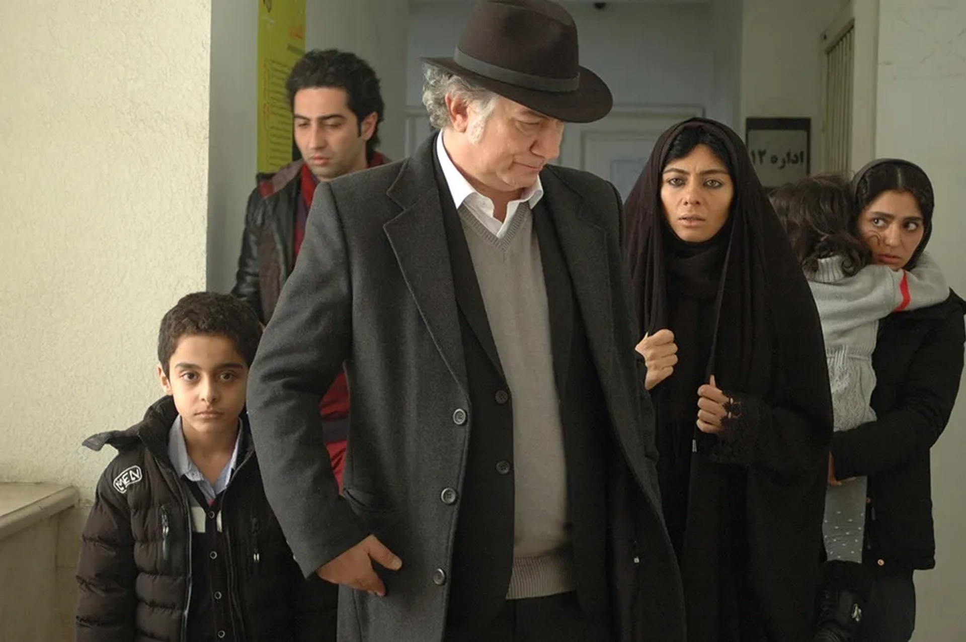 Atila Pesiani, Yekta Naser, and Rojin Rahimi-Tehrani in Simple Worker Needed (2017)