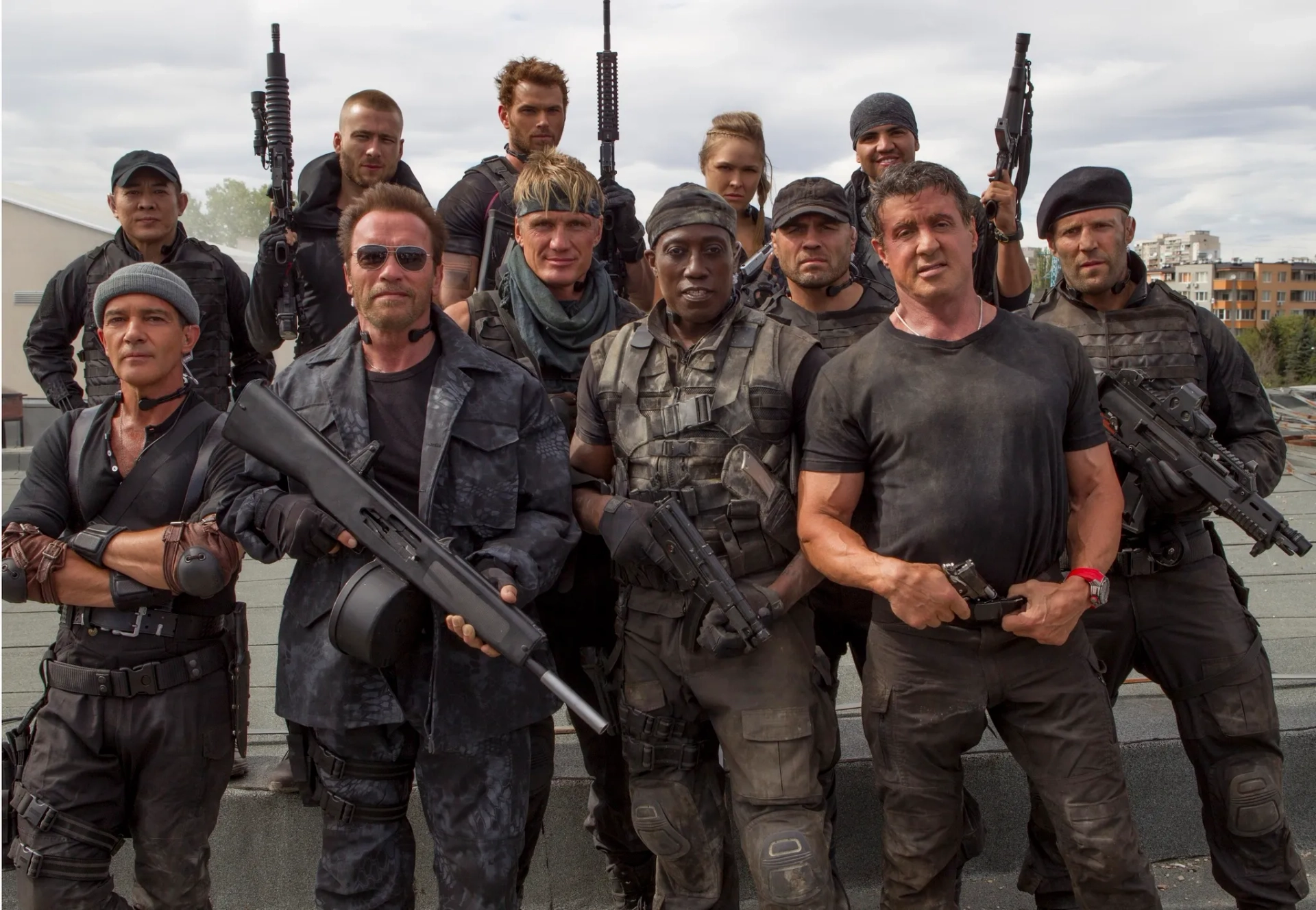 Antonio Banderas, Dolph Lundgren, Arnold Schwarzenegger, Sylvester Stallone, Wesley Snipes, Jet Li, Jason Statham, Randy Couture, Glen Powell, Kellan Lutz, Ronda Rousey, and Victor Ortiz in The Expendables 3 (2014)