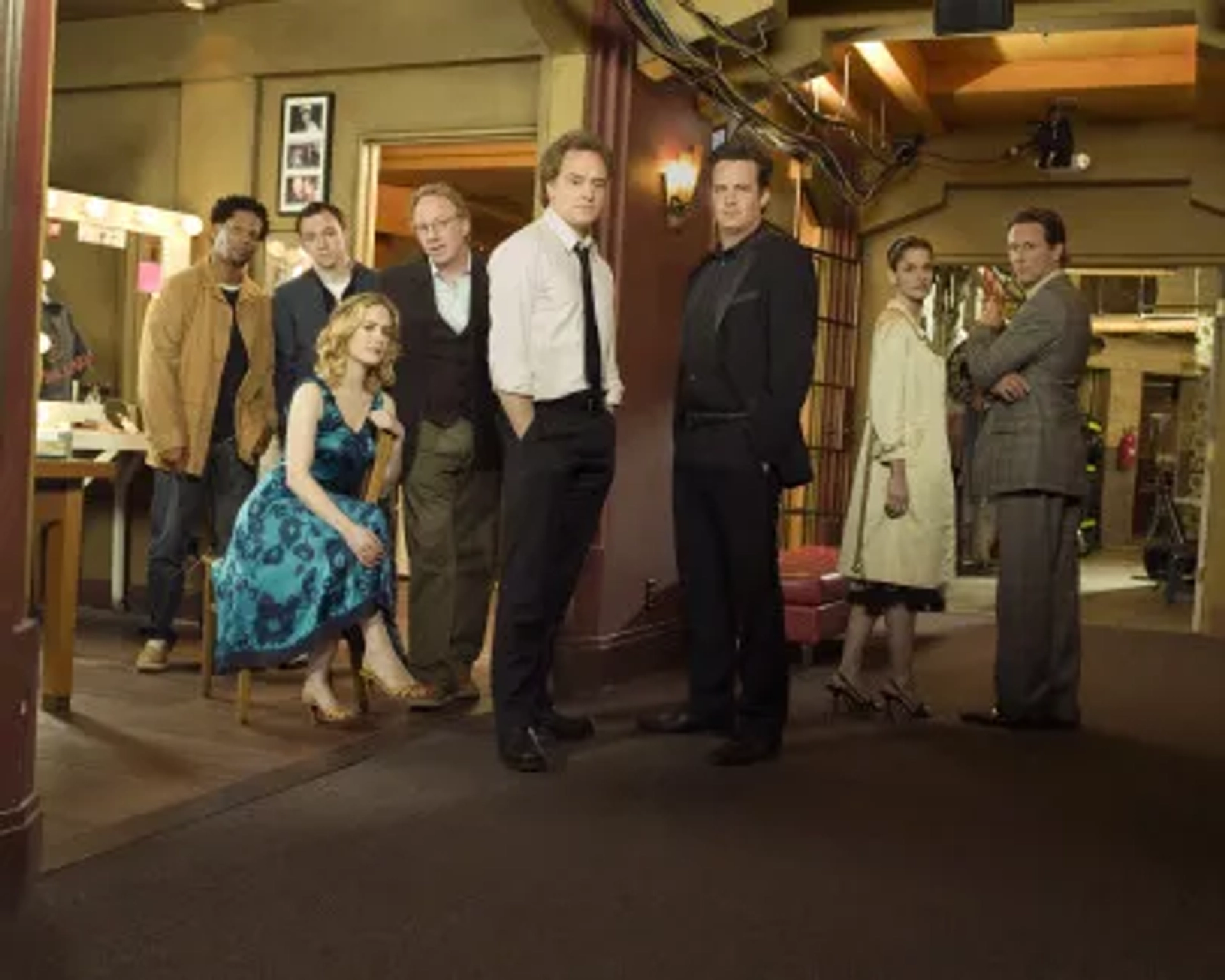 Amanda Peet, Matthew Perry, Steven Weber, Sarah Paulson, Timothy Busfield, D.L. Hughley, Bradley Whitford, and Nate Corddry in Studio 60 on the Sunset Strip (2006)
