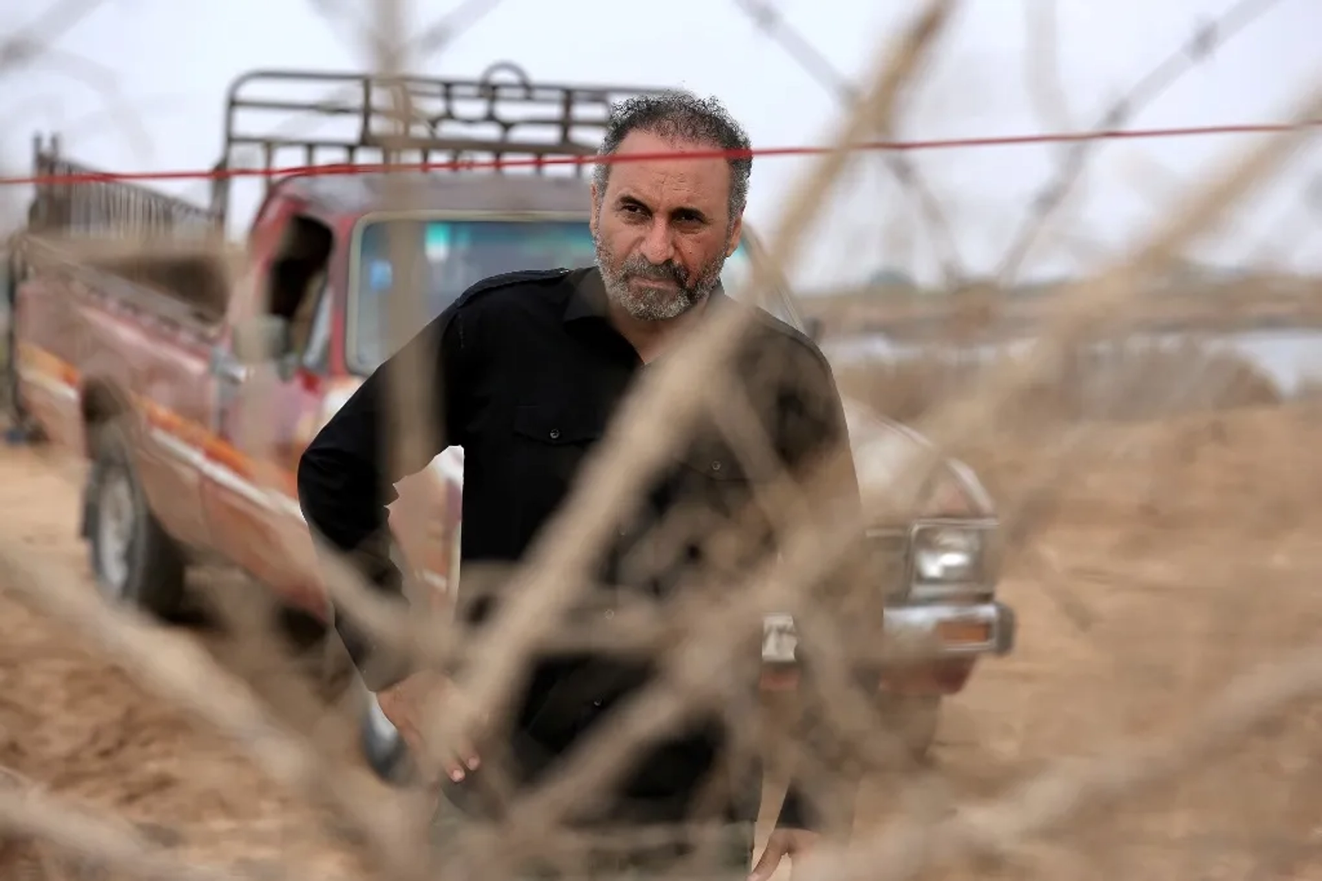 Hamid Farrokhnezhad in Never (2016)