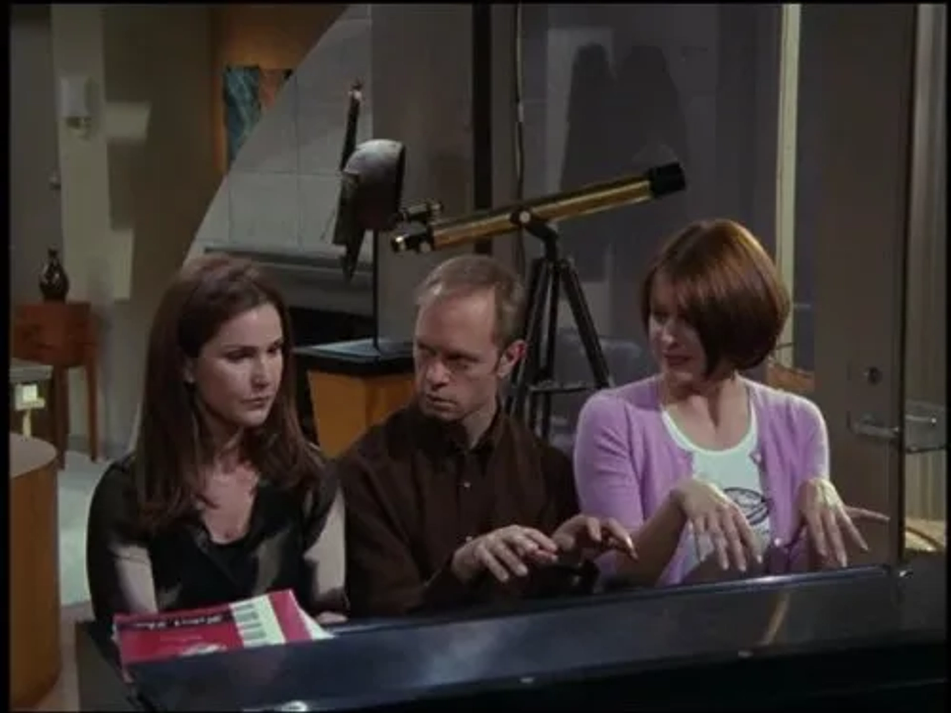 David Hyde Pierce, Peri Gilpin, and Jane Leeves in Frasier (1993)
