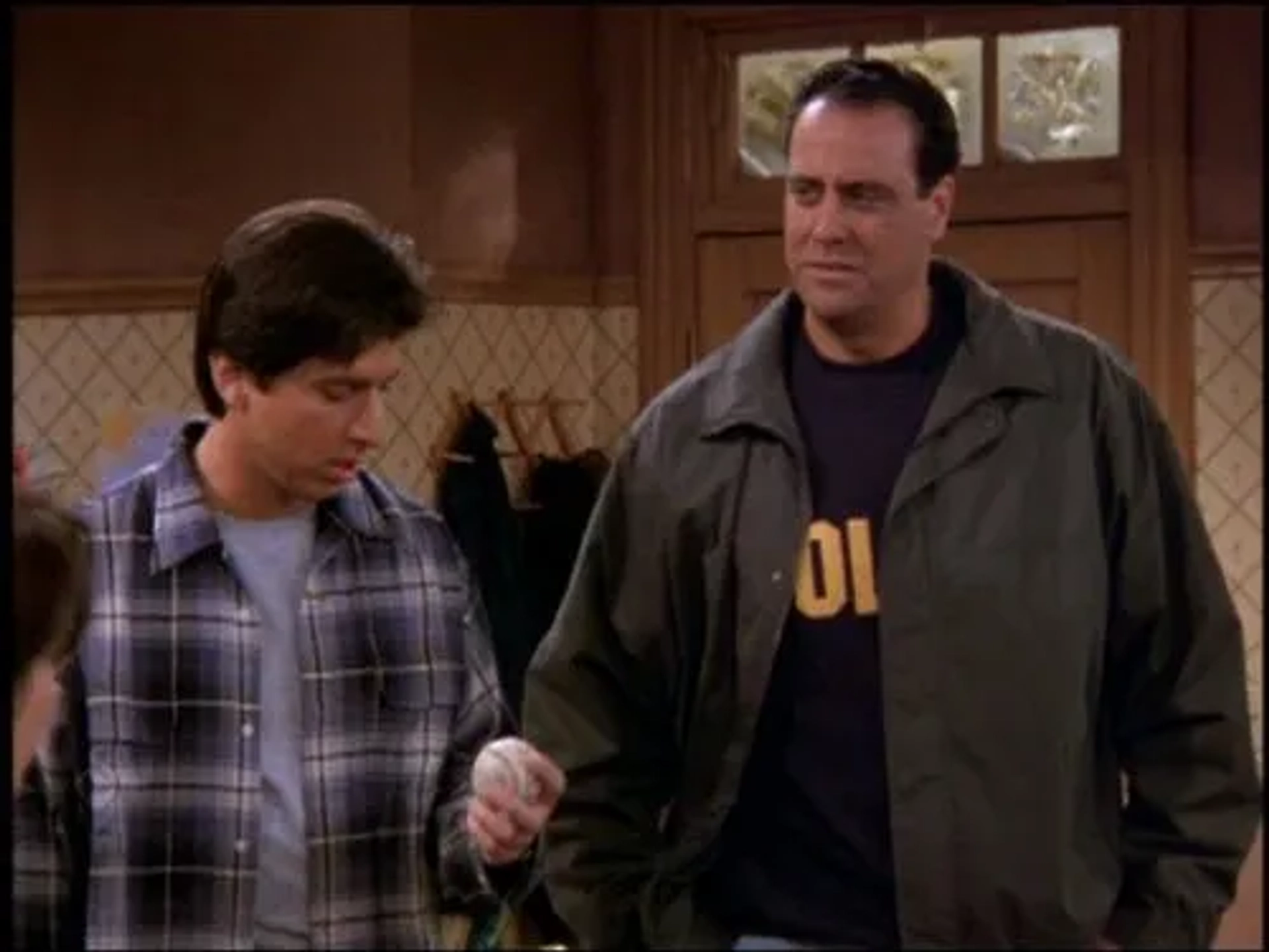 Brad Garrett and Ray Romano in Everybody Loves Raymond (1996)