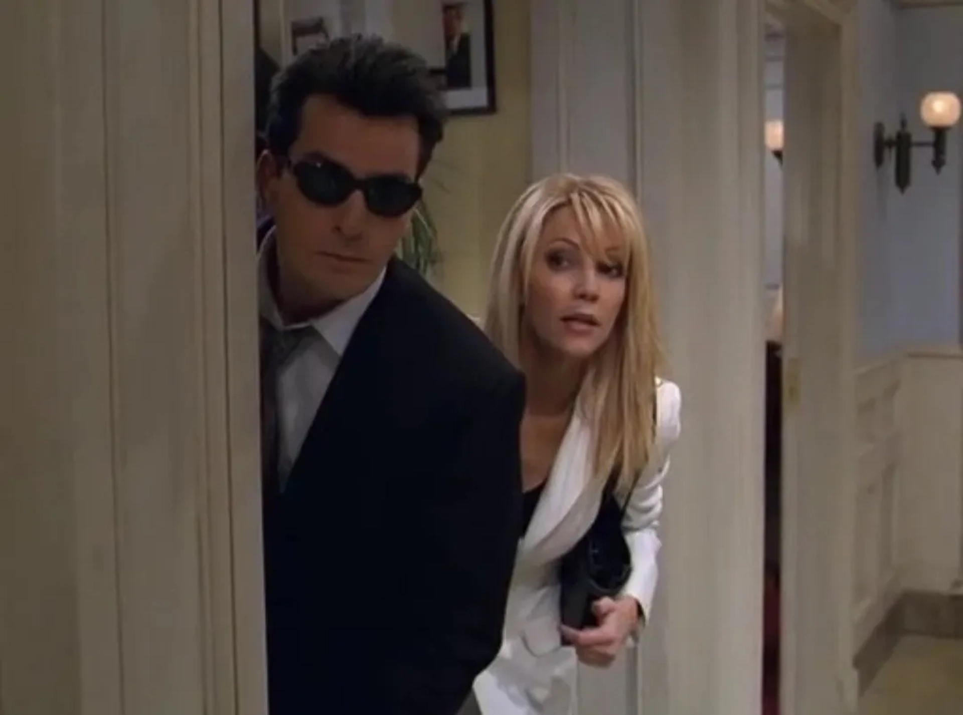 Heather Locklear and Charlie Sheen in Spin City (1996)