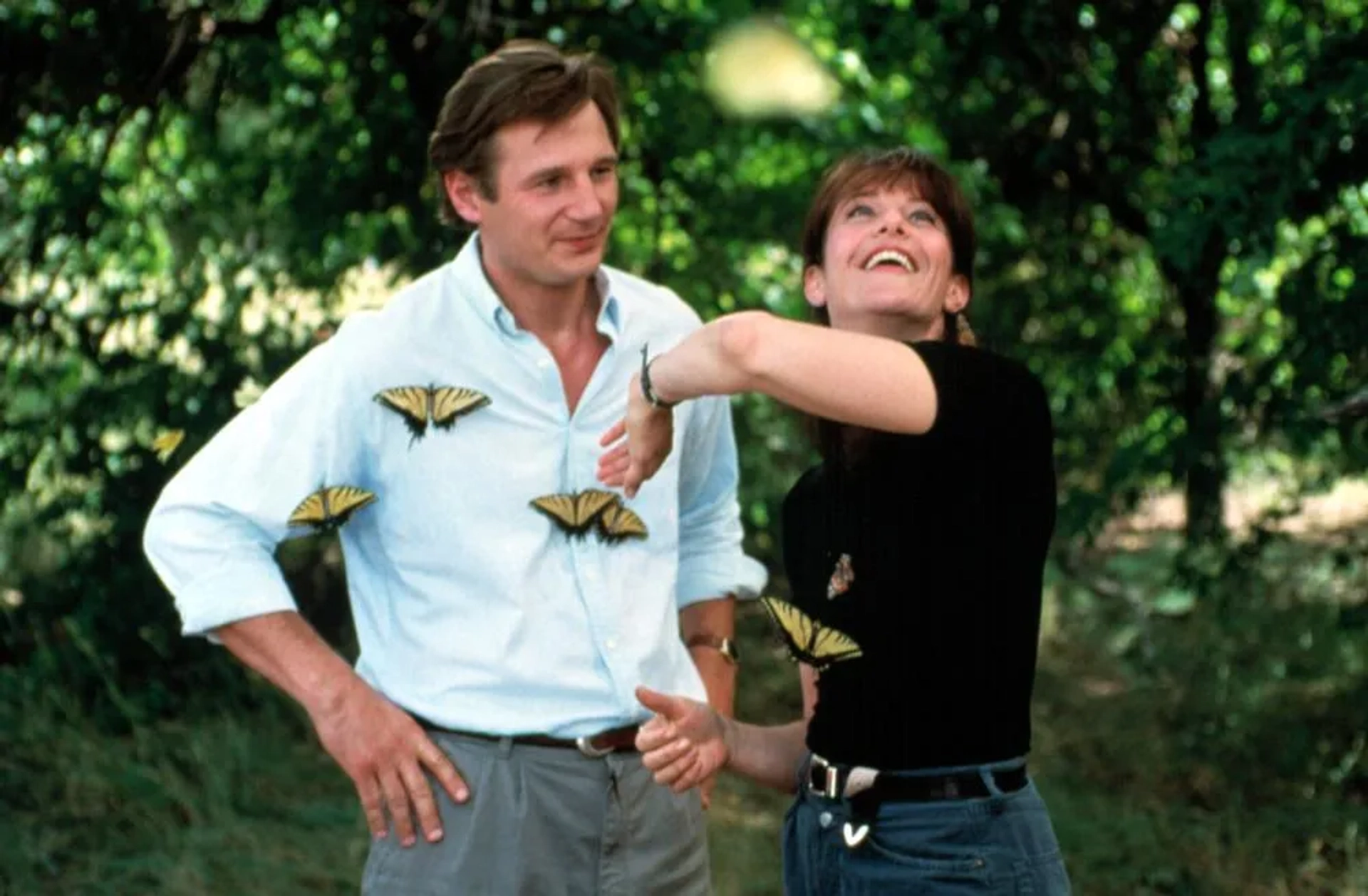 Liam Neeson and Debra Winger in Leap of Faith (1992)