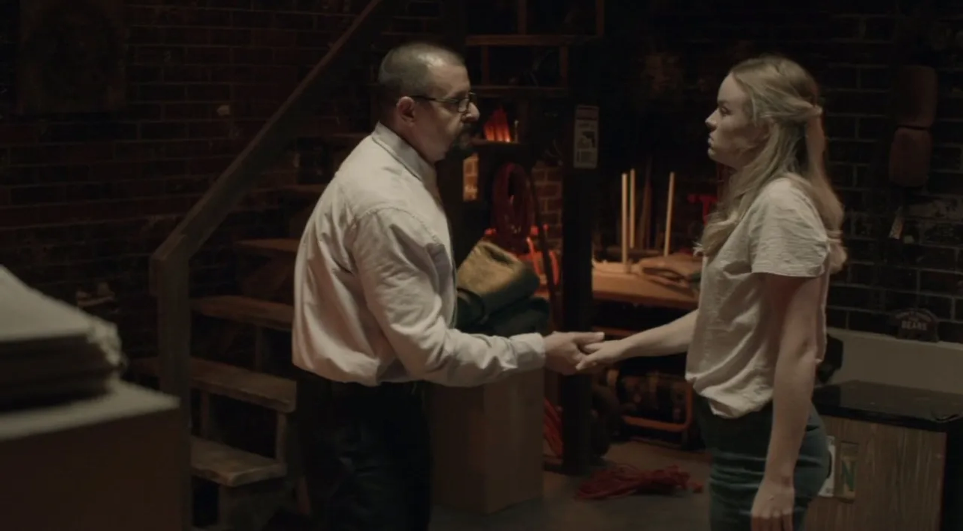 Judd Nelson and Emily Topper in Girl in the Basement (2021)