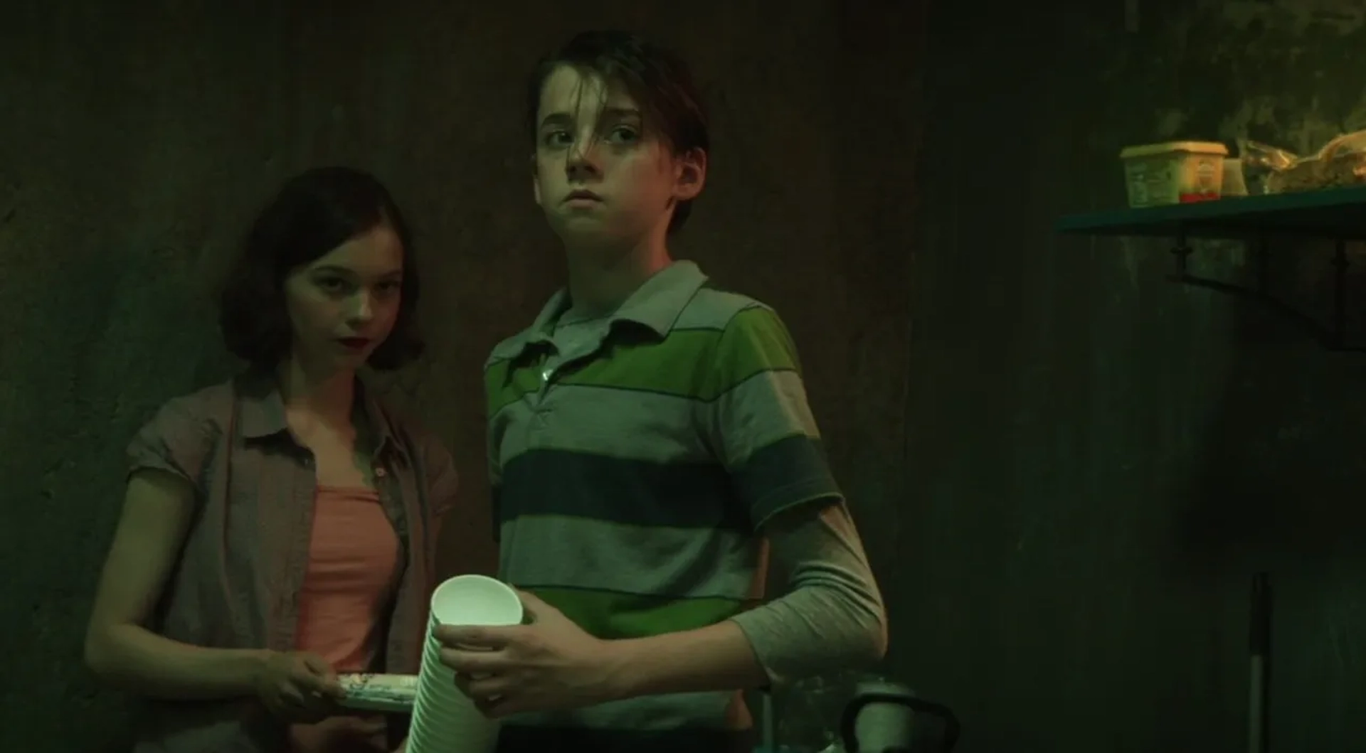 Emma Myers and Braxton Bjerken in Girl in the Basement (2021)