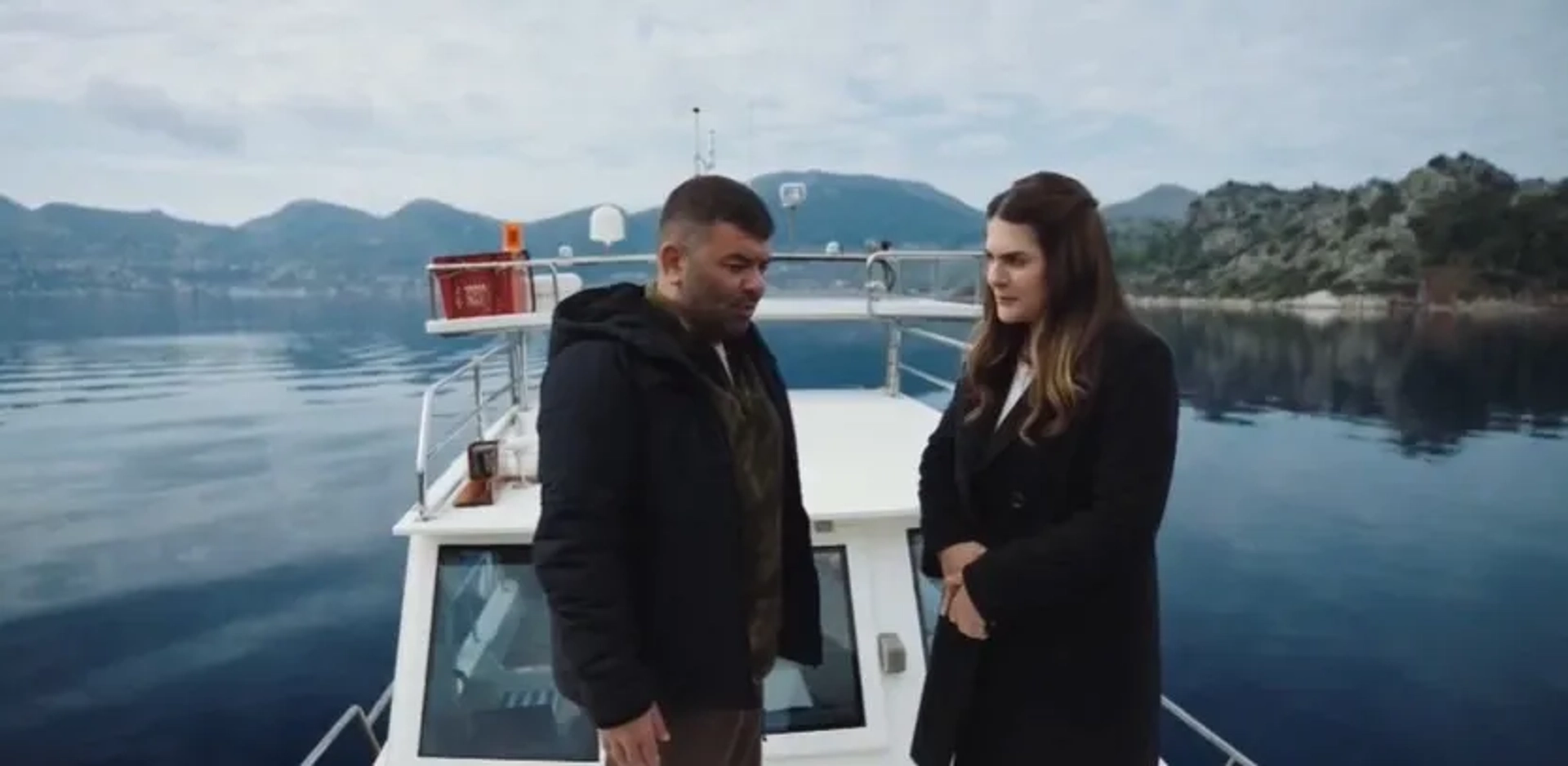 Bülent Sakrak and Ayça Erturan in The Blue Exile (2023)