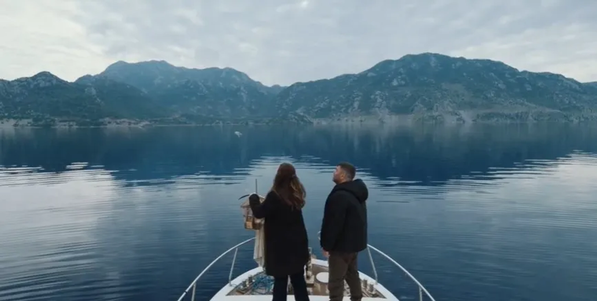 Bülent Sakrak and Ayça Erturan in The Blue Exile (2023)